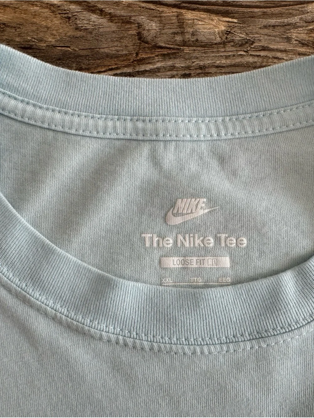 Nike Light Blue Tee with Purple, Red and Teal Icons